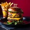 a hamburger and fries are on a plate with a red background.