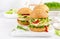 Hamburger with grilled chicken burger, fresh cucumber, tomato, cheese and lettuce