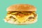 hamburger like in McDonald\\\'s with a beef cutlet on a green background, studio shooting 3