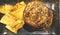 hamburger with nachos on plate on restaurant table.gourmet fast food concept