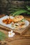 Hamburger with potatoe chips on wooden background