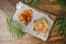 Hamburger with potatoe chips on wooden background