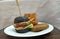 Hamburger and potatoes on the table, white background