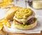 Hamburger served with a topping of guacamole and homemade french fries