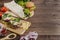 Hamburger, shawarma, sandwiches on a dark wooden background with copy space. Fast food recipes