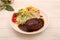 Hamburger steak with demi-glace sauce served on a plate