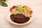 Hamburger steak with demi-glace sauce served on a plate