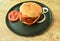 Hamburger stuffed grilled black pepper chicken steak with slice tomato and onion dressing spicy sauce on plate