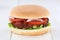 Hamburger tomatoes lettuce wooden board