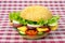 Hamburger with vegetables and sausage. Fast food and breakfast. Calories and diet