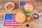 Hamburgers, beer, potatoes, and U.S. flags on a wooden base. Concept 4th of July, Independence Day