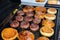 Hamburgers cooking on the grill in garten outdoor