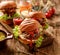 Hamburgers, homemade burgers with grilled buns with addition of addition of beef cutlet, lettuce, tomato,pickled cucumber, grille