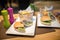Hamburgers served with fries.Colorful.Hamburger with beef meet, vegetables, ketchup and chips on plate.Unhealthy,fatty food