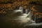 Hamersky creek with waterfalls in Luzicke mountains in color autumn day