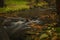 Hamersky creek with waterfalls in Luzicke mountains in color autumn day