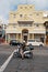 Hamilton, Bermuda - March, 20, 2016: woman on scooter on street. Woman on moped on streetscape. Fast and free woman