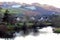 Hamlet, riverside, beneath green and frosty hillside