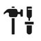 Hammer and chisel black glyph icon