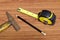 Hammer measuring tape and pencil