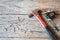 Hammer , Measuring Tape and tack on wood background