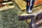 Hammer on a metal anvil in a workshop. Close-up of metalworking tools.