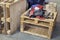 Hammer, nippers tools and working cloth on wooden pallet. Wooden texture.