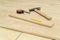 Hammer, pencil, measuring tape or flooring.