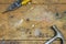 Hammer and pliers on worn wooden workshop background