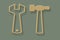 Hammer and spanner shape isolated on brownish funky colored background.