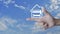 Hammer and wrench with house flat icon on finger over blue sky with white clouds, Business home service concept