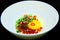 Hammered chicken eggs in a white bowl Sprinkle with chopped chilli With green and red