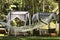 Hammock on the background of cozy gazebos, a place of rest and relaxation in a beautiful tropical garden in Bali island, Indonesia