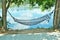 The hammock beside clear water