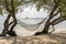 Hammock hang from tropical tree over summer sand beach sea in Phangan island , Thailand. Summer, travel, vacation and holiday