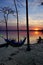 A hammock hanging in the trees at sunset on the shore of Jordan Lake State Park campground in North Carolina