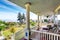 Hammock and patio area with armchairs at the wooden walkout porch