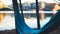 Hammock for relaxing on background of nature lake, chilling outdoor, traveler recreation mountain landscape; camping lifestyle