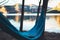 Hammock for relaxing on background of nature lake, chilling outdoor, traveler recreation mountain landscape; camping lifestyle