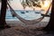 hammock by the seaside at sunset - holiday relaxation