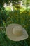 Hammock and straw hat in the garden on a summer da