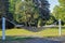 A hammock stretched over two white posts in a city park in Gdynia