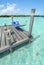 Hammock swinging in a pier by a tropical landscape