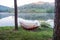 Hammock tied to tree on reservoir