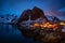 Hamnoy mountain at sunset with house lights