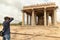 Hampi, India July 8, 2019 : Photographer taking the picture of Holy Sasivekalu ganesha temple in Hampi, Karnataka, India