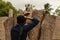 Hampi, India July 9, 2019 : Tourist trying to catpure Ugra Narsimha or Lakshmi Narsimha at Hampi. The man-lion avatar of Lord