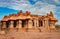 Hampi ruins antique stone art piece with amazing blue sky at vithala temple