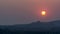 Hampi Sunset behind the boulders with mountains silhoutte