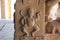 Hampi Vittala Temple Male deity in dance pose holding a snake Naga in the right hand pillar carving